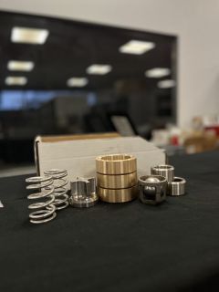 bague avant, bague arrière, bille, clapet, ressort, guide clapet